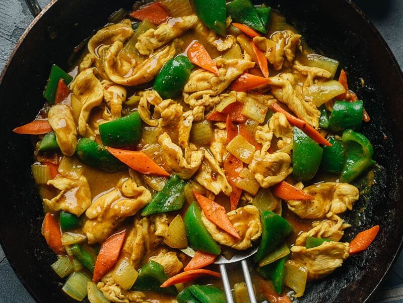 chinese curry chicken in a frying pan.