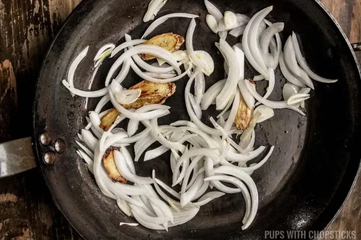 Stir frying onions and ginger and garlic together.
