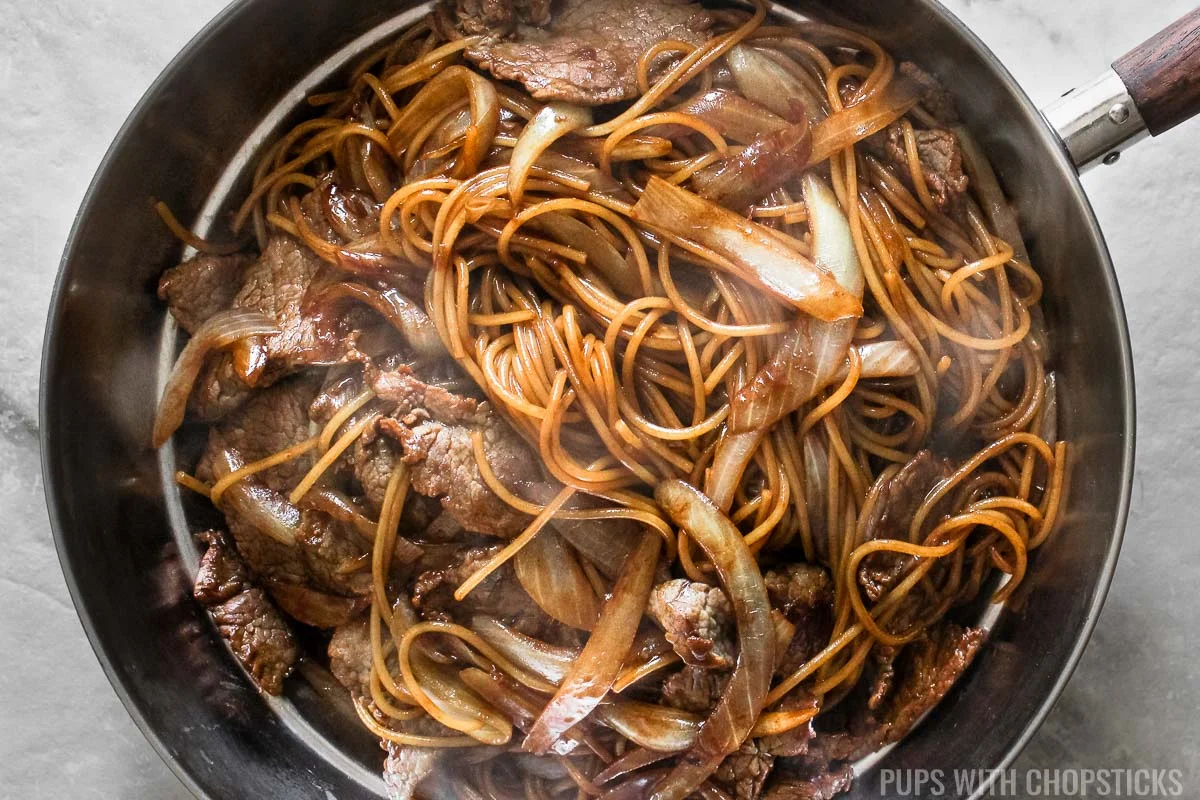 Closeup of beef noodle stir fry in a pan