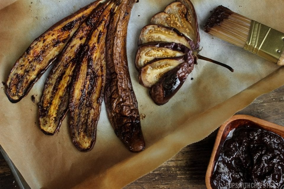 Eggplant brushed with Black garlic miso after it has roasted in the oven.