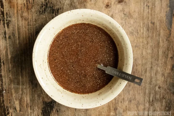 black pepper sauce in a beige bowl.