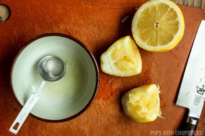 Lemon juice squeezed into a small bowl