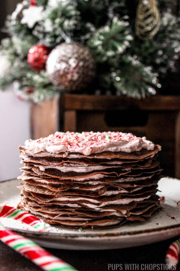 Candy Cane Chocolate Crepe Cake on a plate on a table
