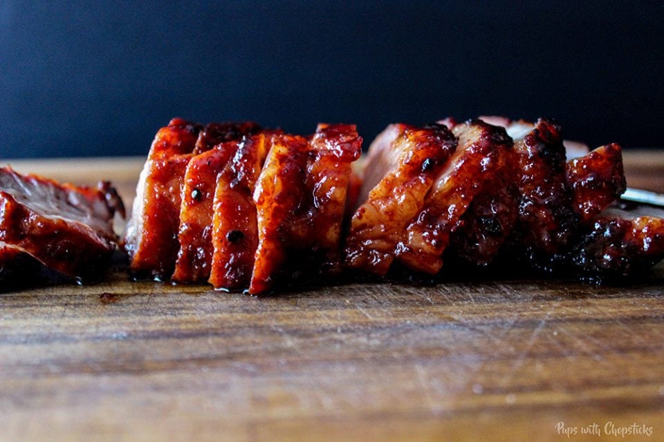 Chinese BBQ Pork (Char Siu) Cut thinly on a cutting board