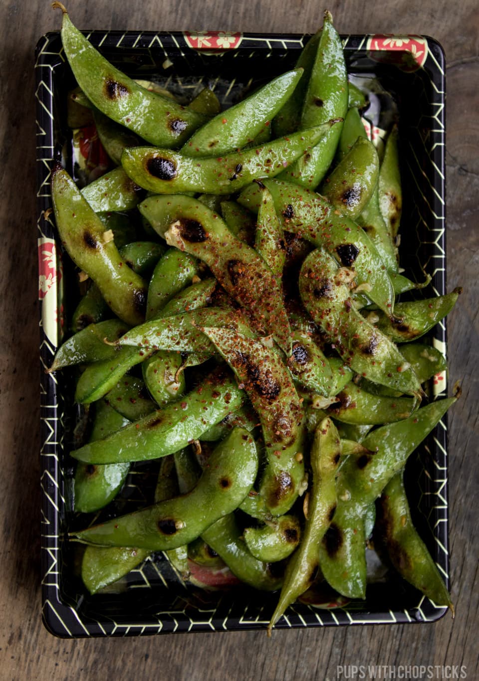 Quick & easy buttery charred Edamame recipe loaded with natural umami and tossed with a garlicky lemon butter. Quick, healthy and flavorful snack! #snack #vegan #vegetarian #edamame #quickandeasy #appetizer #recipe #beans #roasted