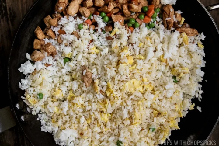 Add rice and keep cooking until eggs are dry.