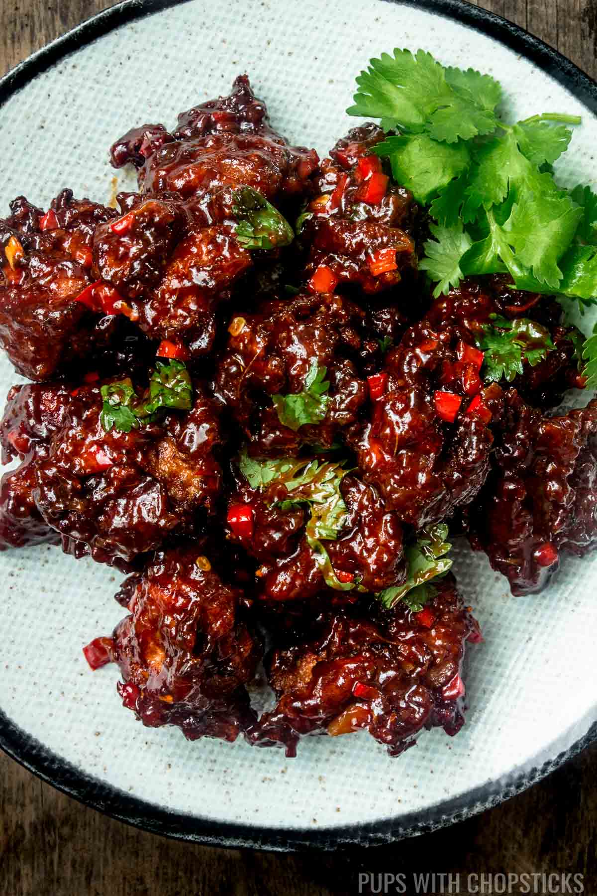 Close up of chicken Manchurian garnished with parsley