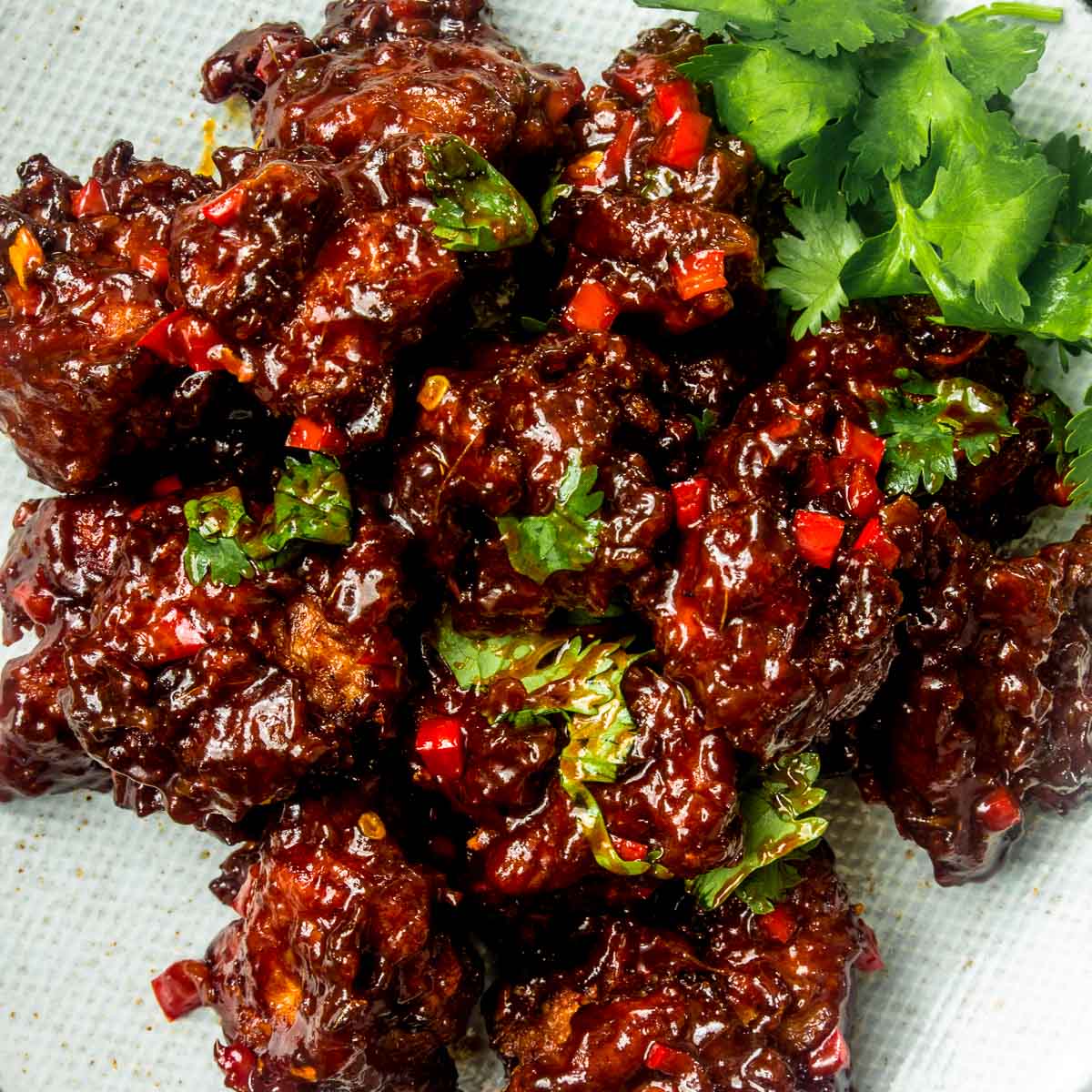Close up of Chicken Manchurian garnished with parsley