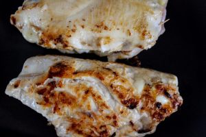 Browning the chicken breast for Stuffed Chicken Marsala with Cheesy Caramelized Onions