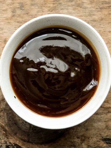 Chinese brown sauce in a white bowl.