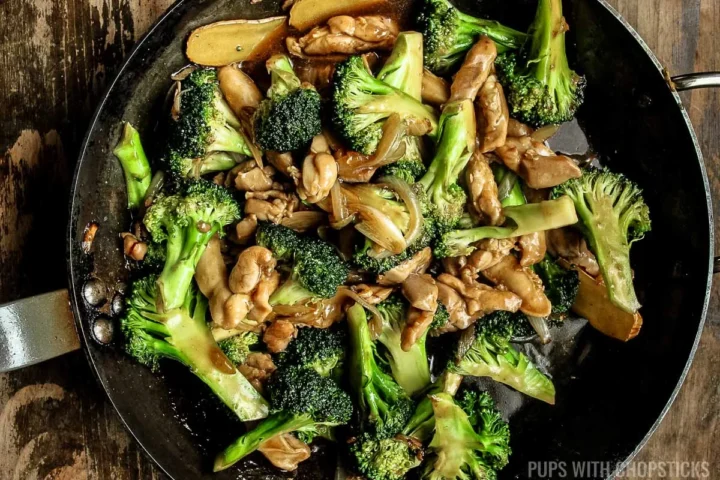 chicken and broccoli stir fry finished in a frying pan.