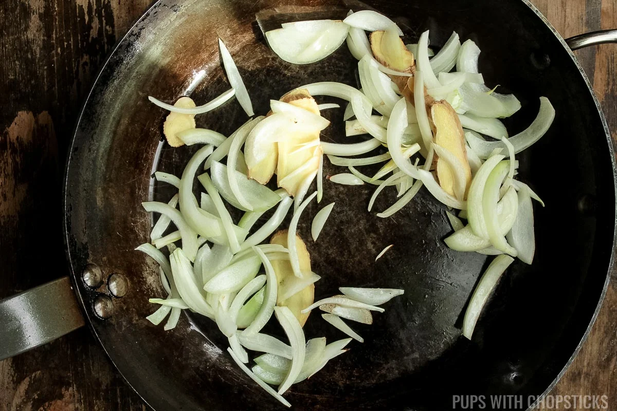stir frying ginger, garlic and onions.
