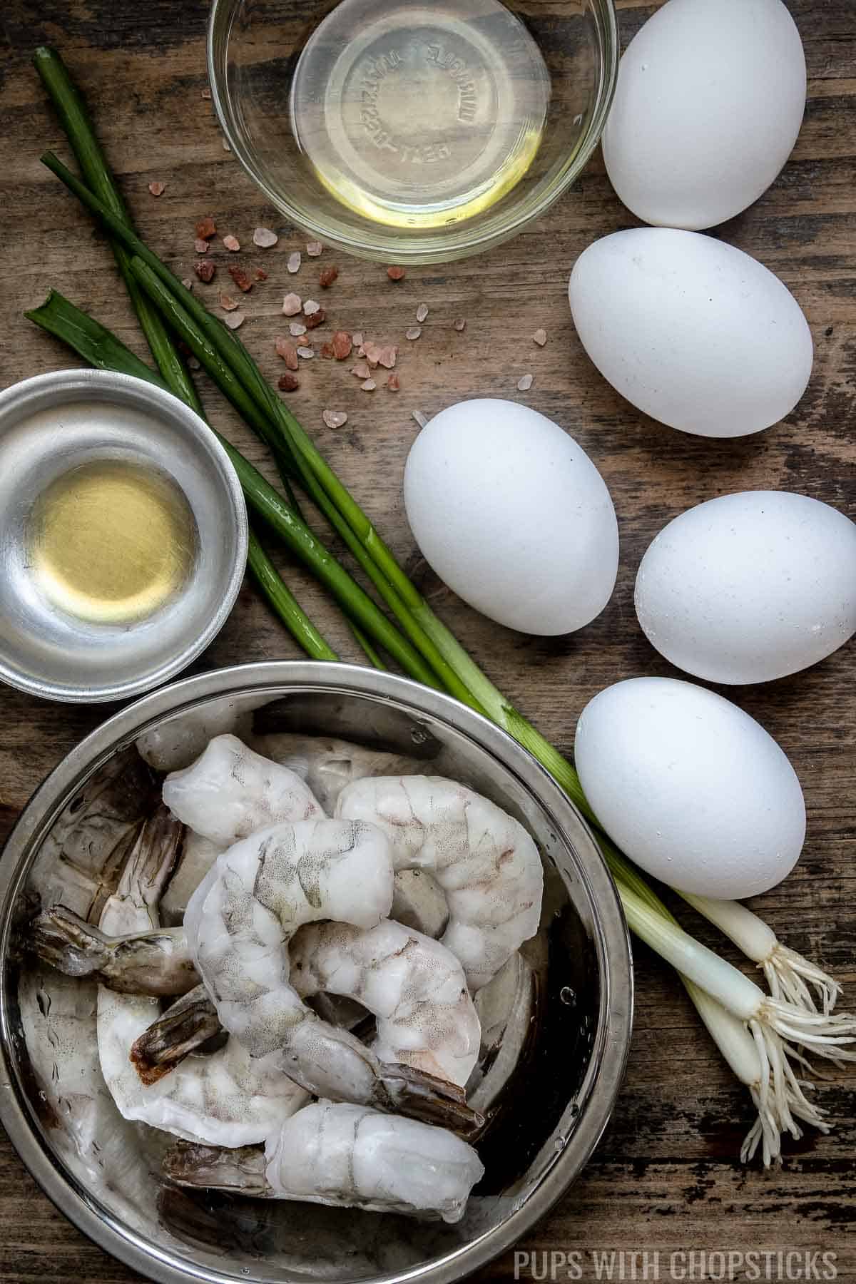 Mise en place for Chinese scrambled egg stir fry with shrimp (eggs, shrimp, sesame oil, salt, green onions, oil)