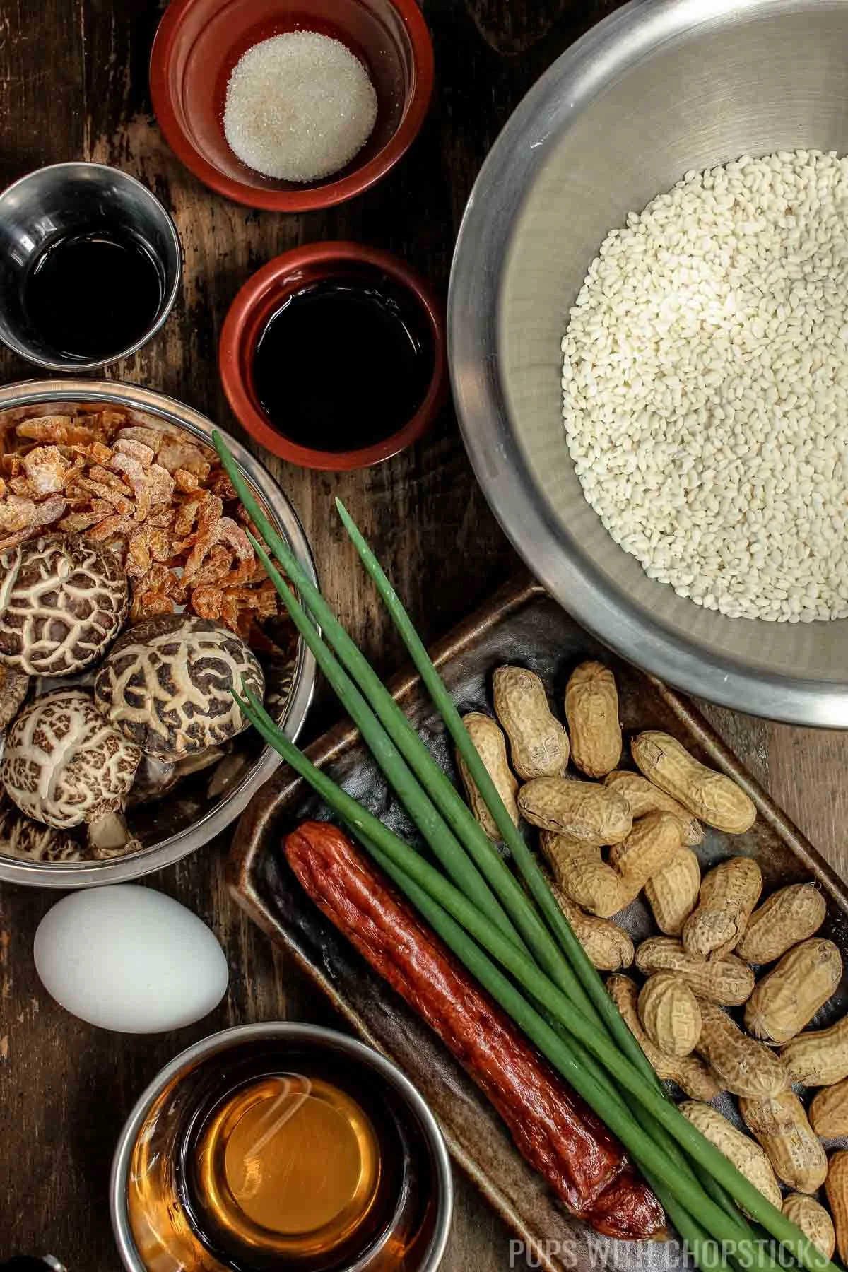 Ingredients for Chinese Sticky Rice (Lo Mai Fan), glutinous rice, lap cheong (chinese sausage), shiitake mushrooms, soy sauce, sugar, dried shrimp