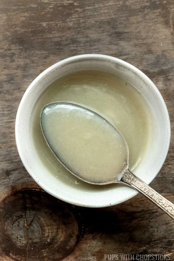 Chinese white stir fry sauce in a white bowl.