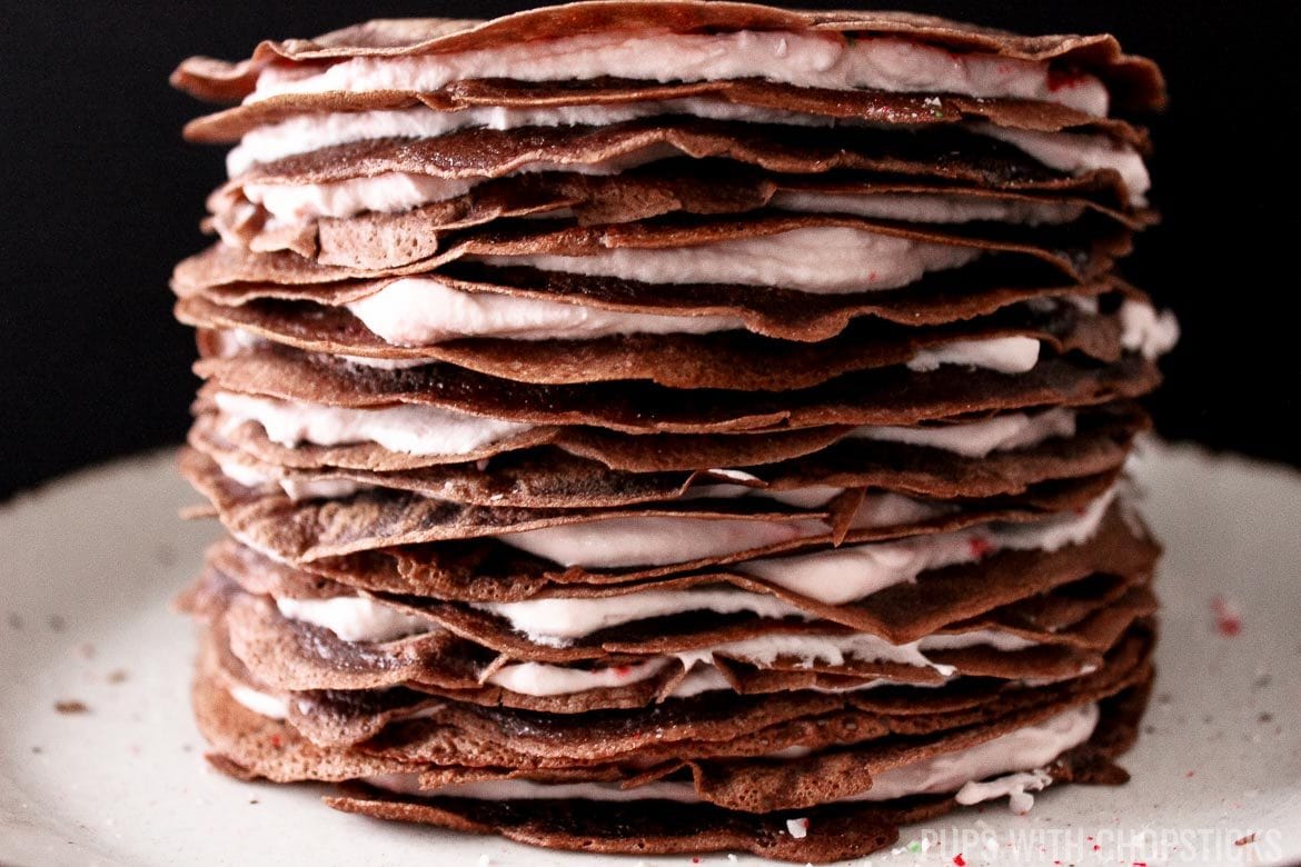 Side profile of Candy Cane Chocolate Crepe Cake to show the layers of the cake