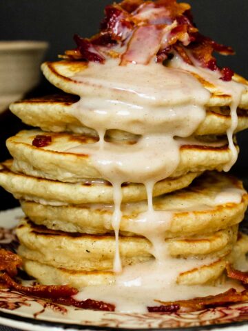 Condensed milk pancakes with candied bacon on top.