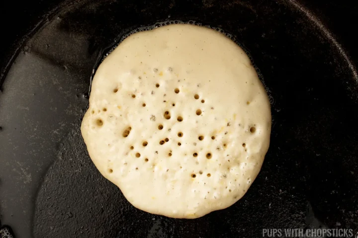 pancake in a pan with holes.