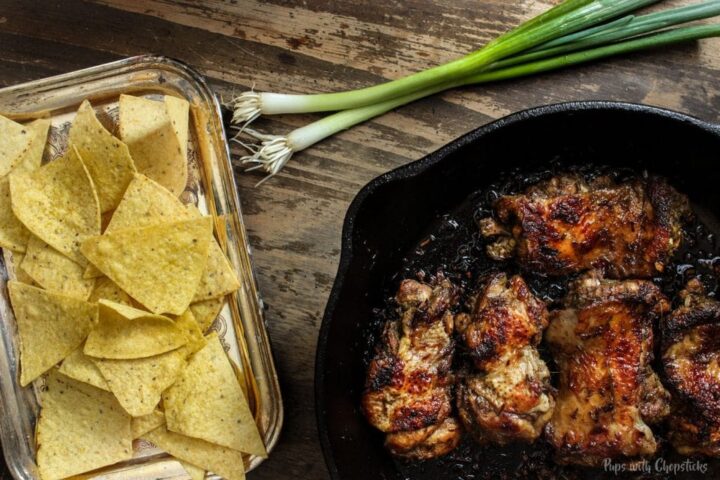 Chicken being pan-fried in pan for crispy chicken tacos