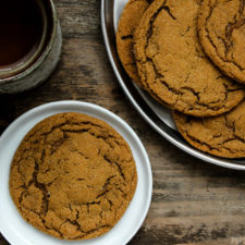 Five spice ginger molasses cookies being served with a side of tea