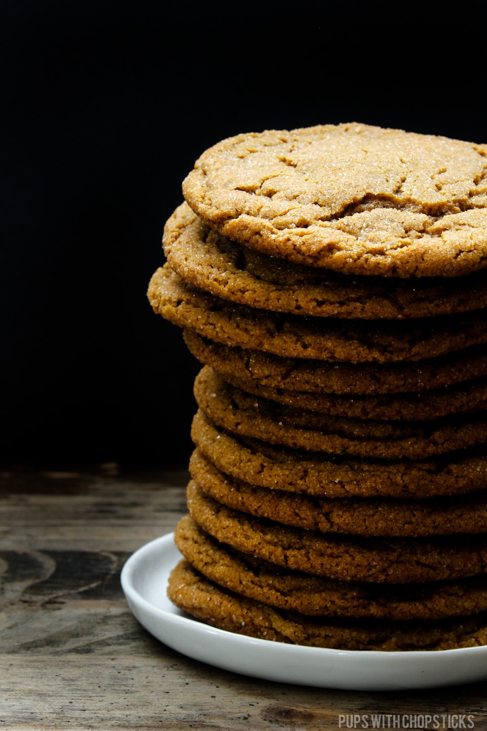 A tall stack of five spice ginger molasses cookie on a plate