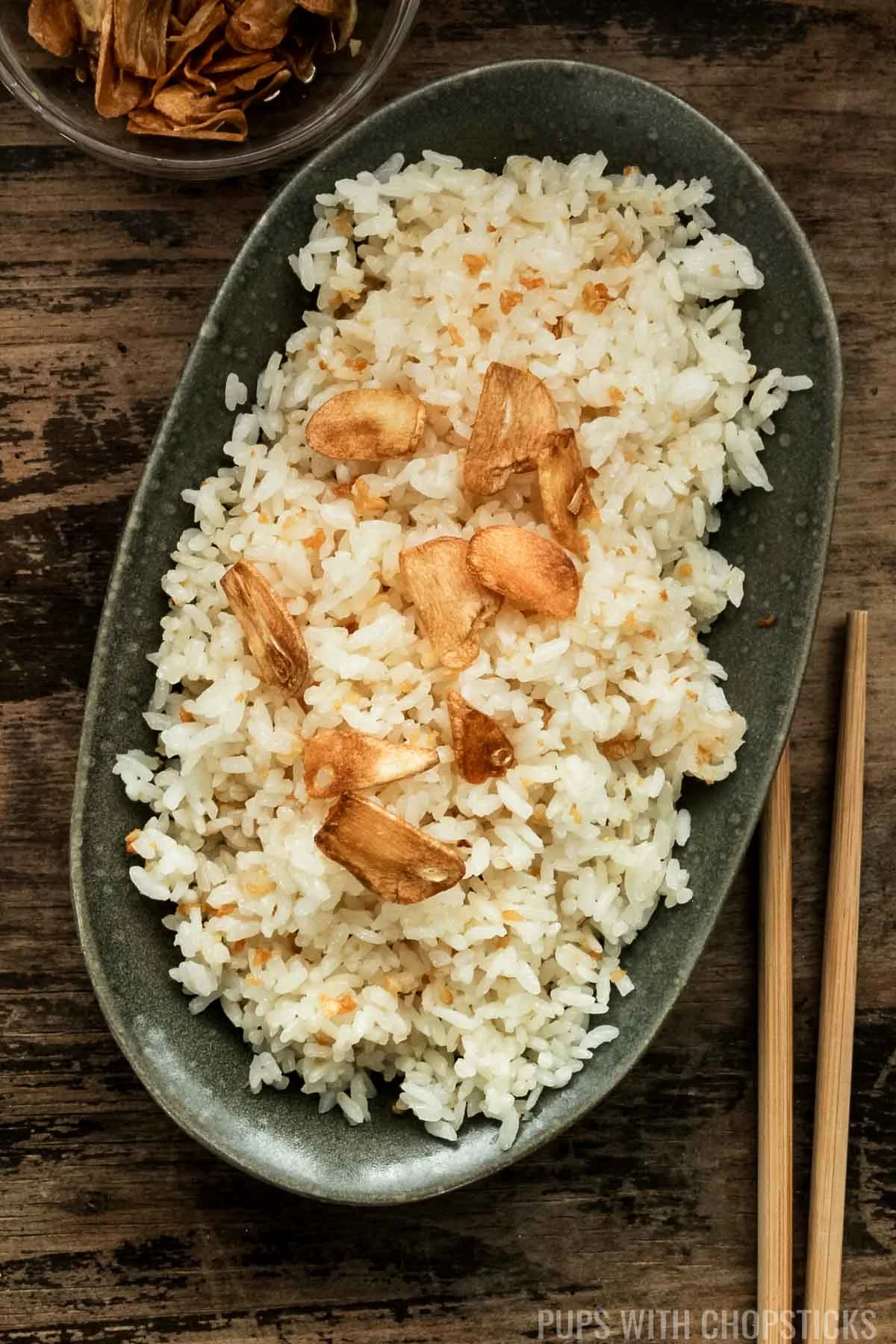 Garlic Fried Rice (Sinangag) in a green bowl with garlic chips