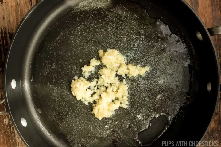 Garlic fried in oil in a frying pan