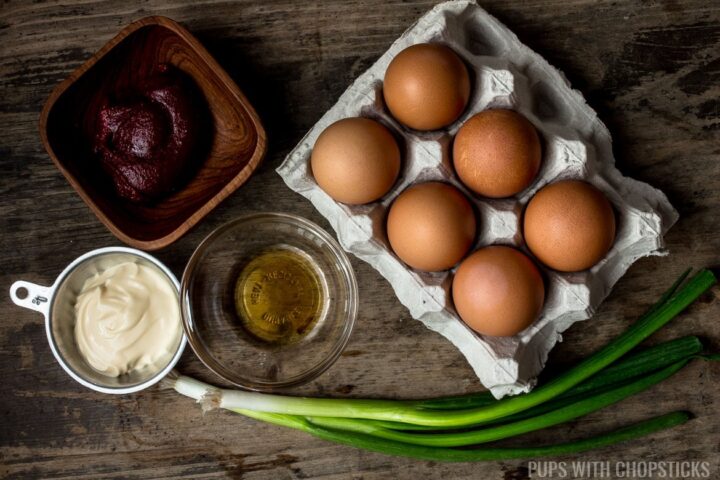 Korean deviled eggs ingredients (eggs, gochujang, mayonnaise, sesame oil, green onions)