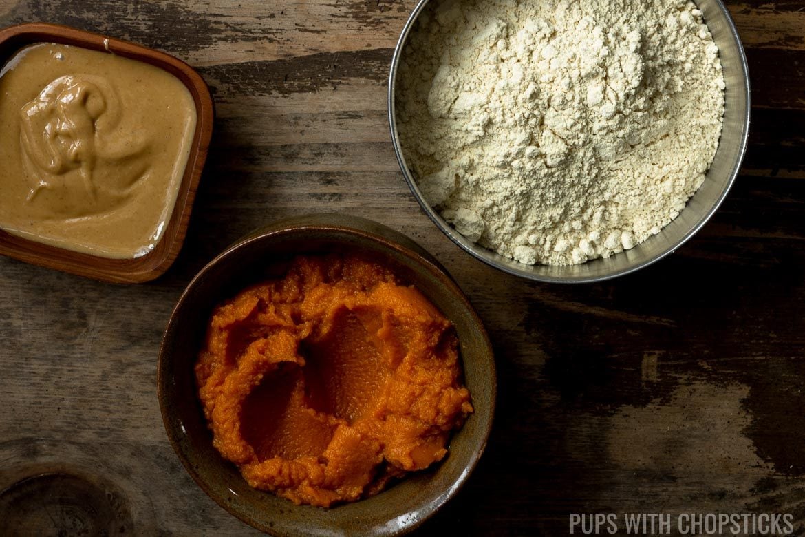 A bowl of chickpea flour, peanut butter and pumpkin for grain free dog treats
