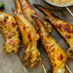 Closeup of Grilled curry chicken wings