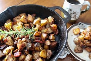 Skillet Potatoes Infused with Caramelized Onions in a cast iron pan 