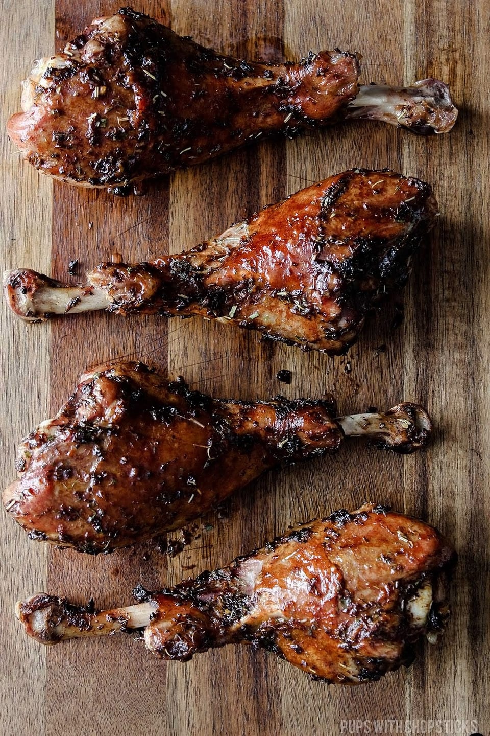 Herb roasted turkey legs on a cutting board