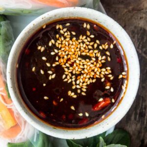 Close up of a easy to make hoisin dipping sauce served with fresh rice rolls