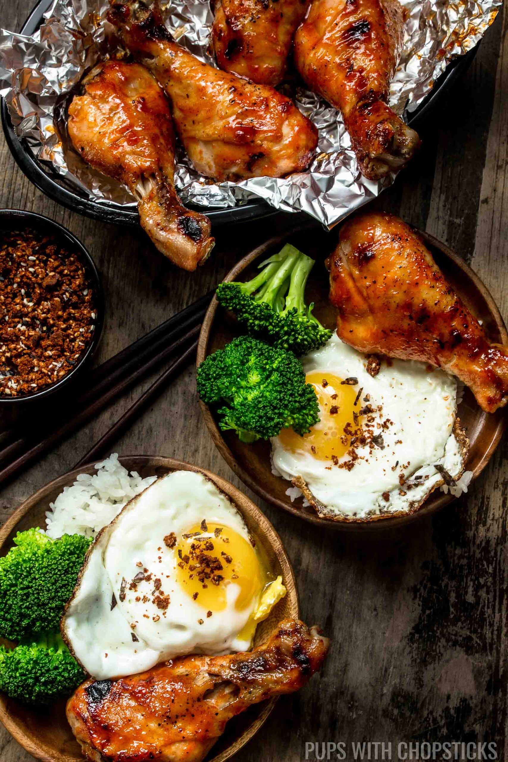 Sweet & Spicy Honey Sriracha Chicken served with rice, broccoli and a fried egg