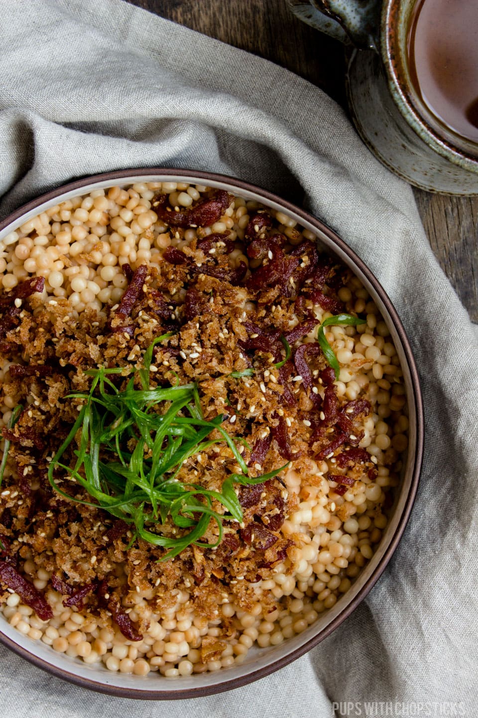 An deliciously nutty and flavourful israeli couscous recipe with a bit of a chew, generously topped with crispy garlic anchovy bread crumbs. Works great as a quick and easy side dish or a one bowl meal! #couscous #sidedish #recipe #salad #crispy