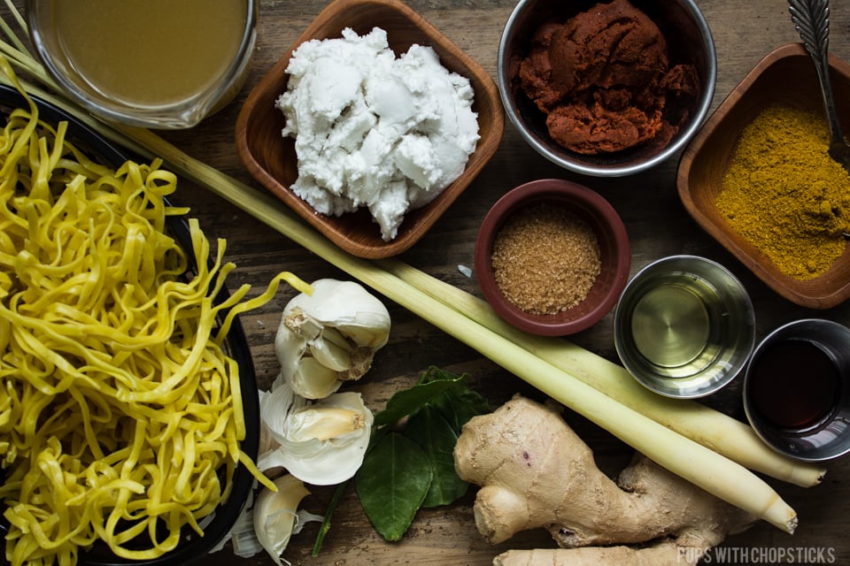 Khao soi (Thai Coconut Curry Noodle Soup) Ingredients laid out on the table