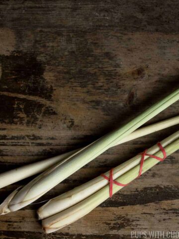 lemongrass tied with red rubberbands on wooden table