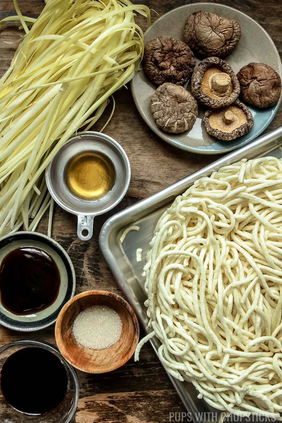 Longevity noodles (yee mein) ingredients (yi mein noodles, shiitake mushrooms, oyster sauce, sesame oil, soy sauce, chinese yellow chives, sugar)