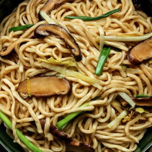 Thumbnail of Longevity noodles (yi mein) in a green bowl.
