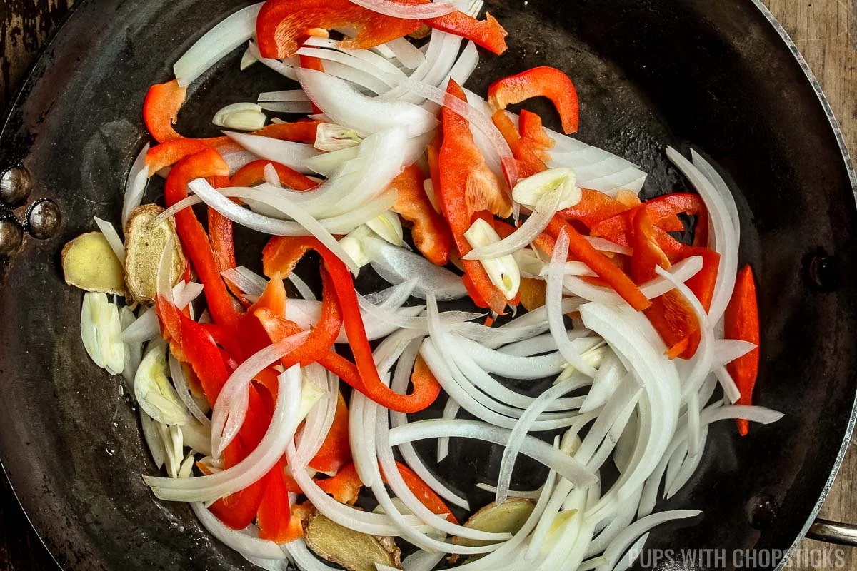 Stir frying onions, red pepper and garlic for Mongolian Beef