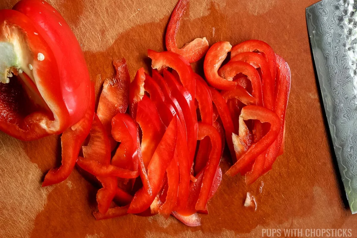 Red peppers sliced on cutting board