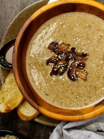 mushroom garlic soup in a wooden bowl.