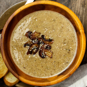 thumbnail of mushroom garlic soup in a wooden bowl.