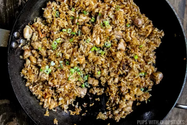 Add the green onions to the pan for the nasi goreng.