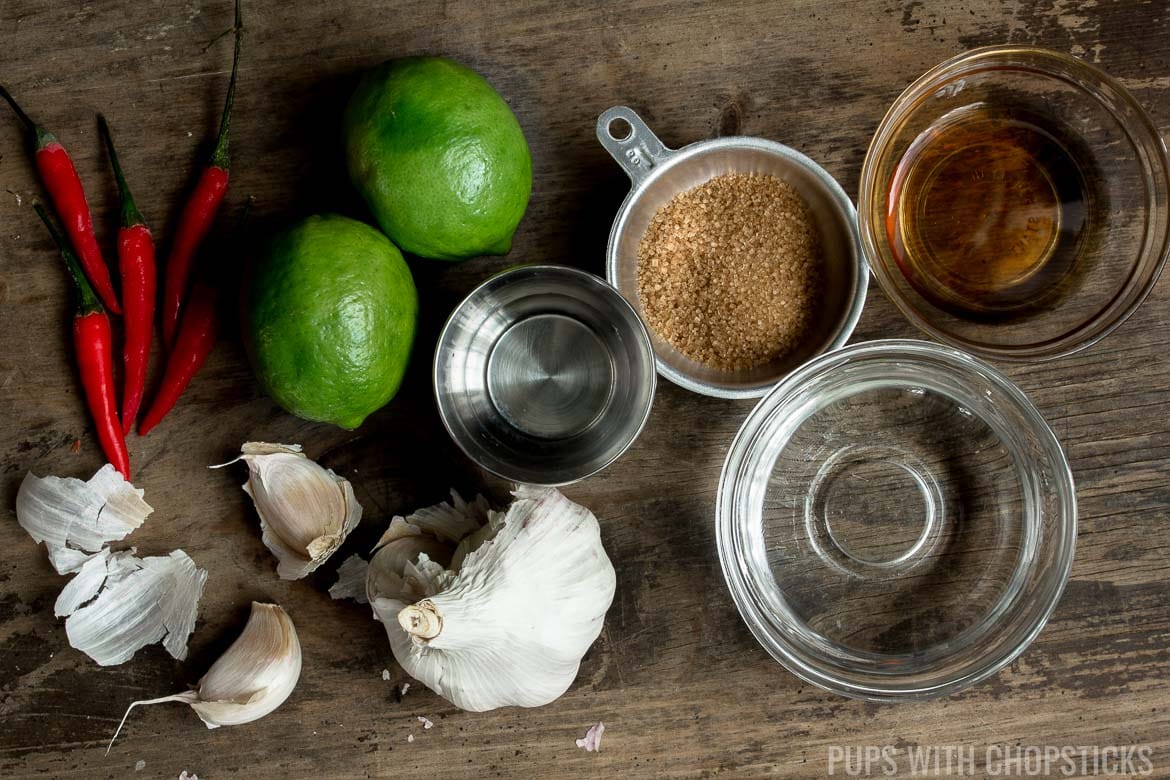 Vietnamese Fish Sauce Dipping Sauce (Nuoc Cham / Nuoc Mam) ingredients laid out on a wooden table