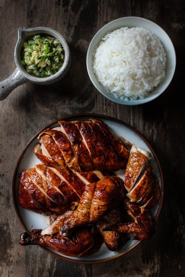 Peking chicken served with a bowl of rice and ginger scallion sauce