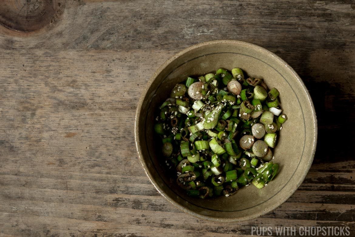 Marinating scallions in a bowl for scallion pancakes