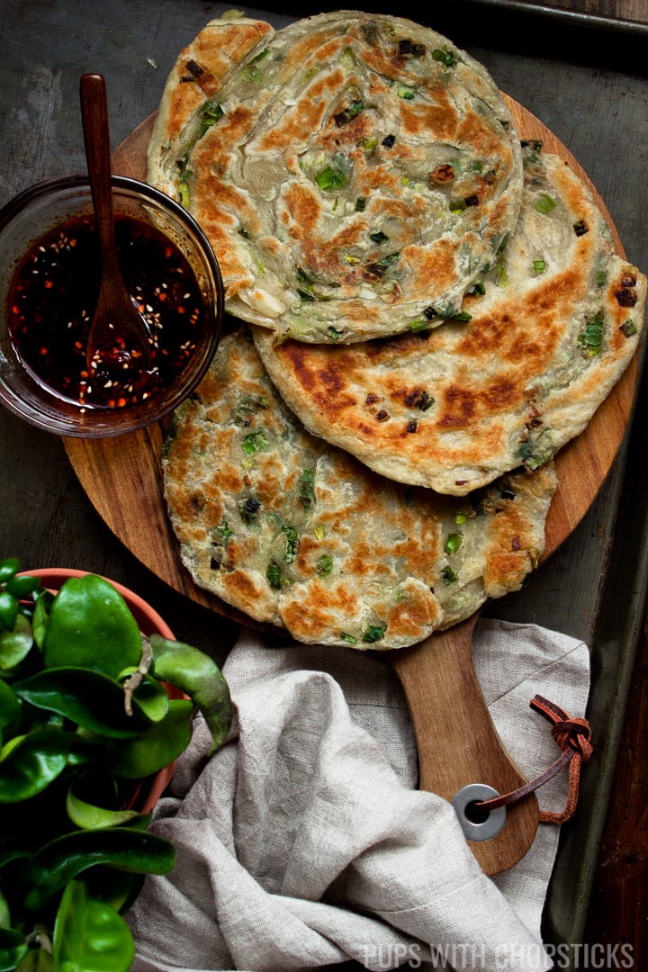 Scallion pancakes laid out with dipping sauce