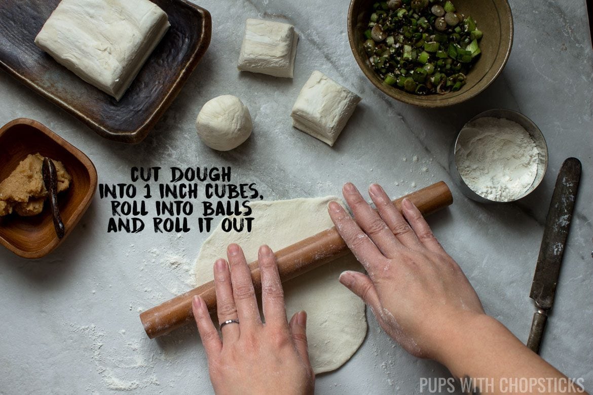 Rolling out Scallion pancakes - Step 1, Cut dough into 1 inch cubes, roll it into balls and flatten out with rolling pin