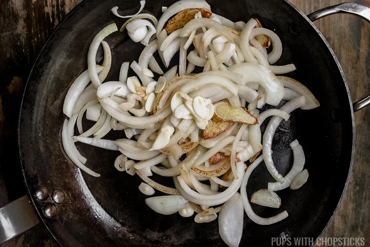 stir frying onions, and ginger.